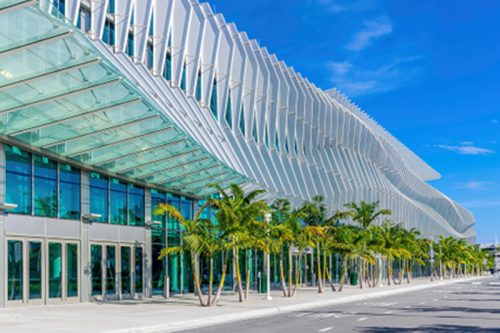 Miami Beach Convention Center with palm trees